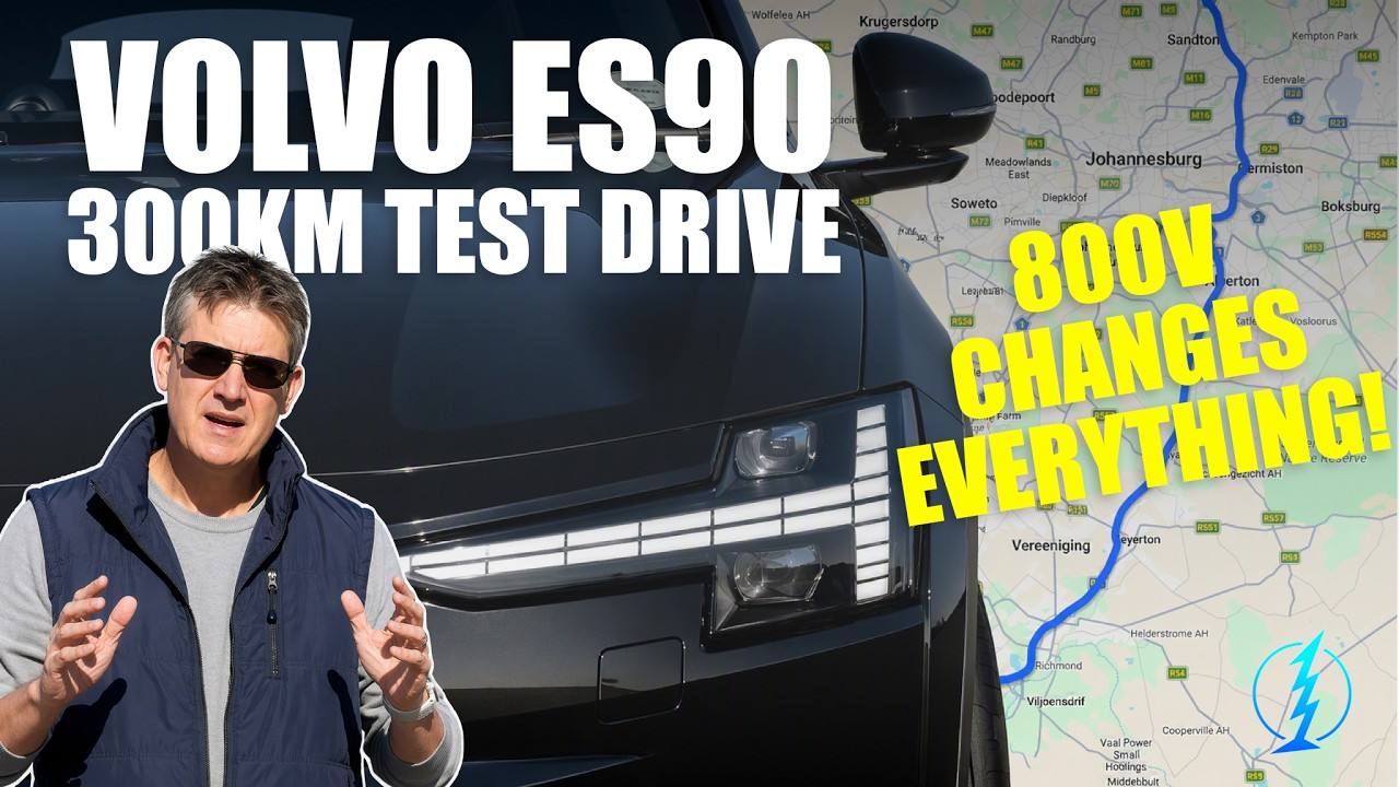 Greg Cress beside a Volvo ES90 with an 800V road-trip route map